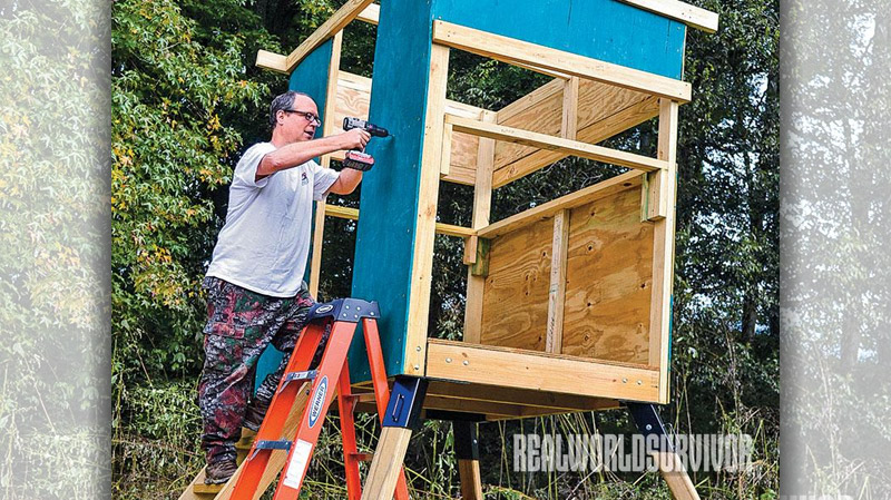 The prepainted plywood panels being added to the frame.