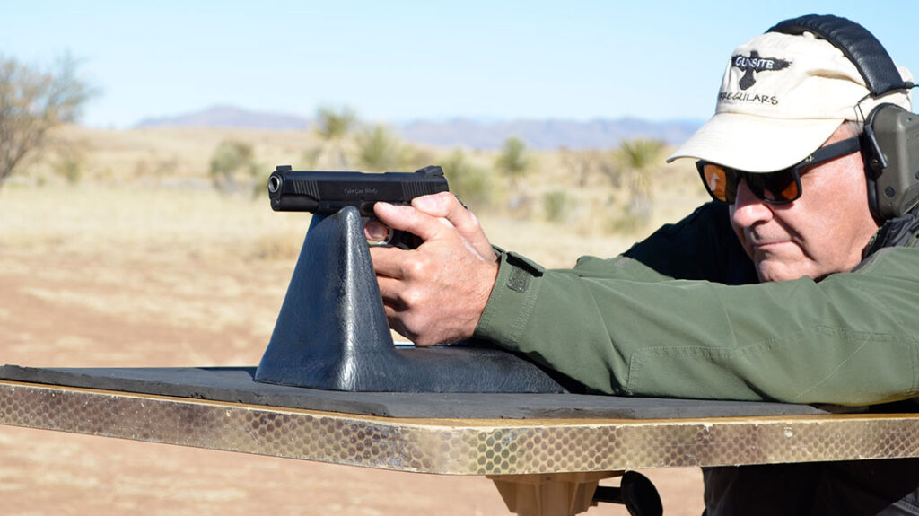 The author shooting the Tyler Gun Works 1911 from the bench.