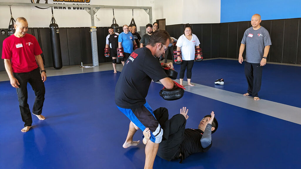 During a Tiga Tactics Street Combatives Seminar, participants get a chance to train on defensive techniques should they find themselves on the ground.