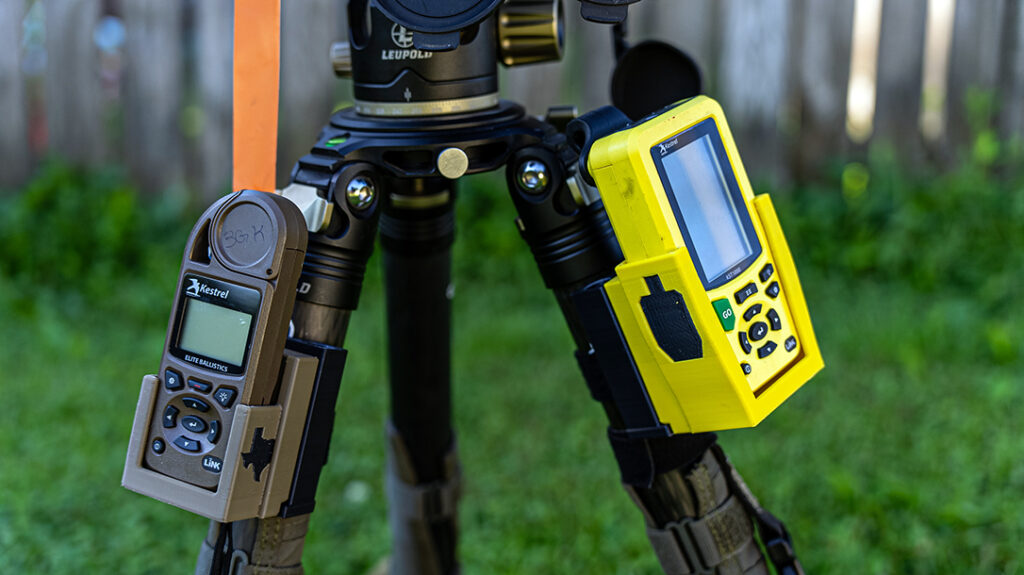 Kestrell Ballistics Weather Meter and gear on a tripod.