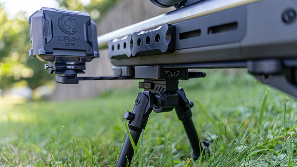 A chronograph mounted to the rifle setup. 