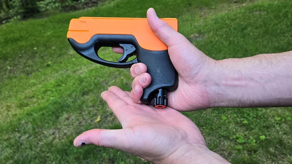 To charge the Umarex P2P HDP 50 Compact, strike the big button on the bottom of the grip.