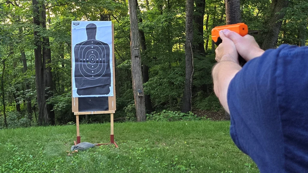 The author testing the pepper ball gun.