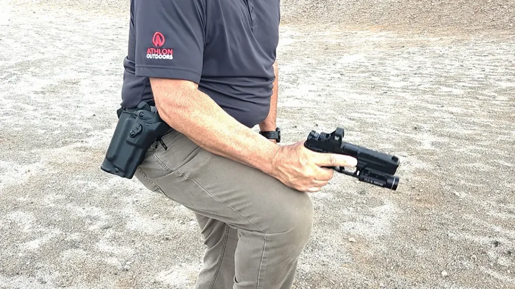 Tap the magazine by using your knee.