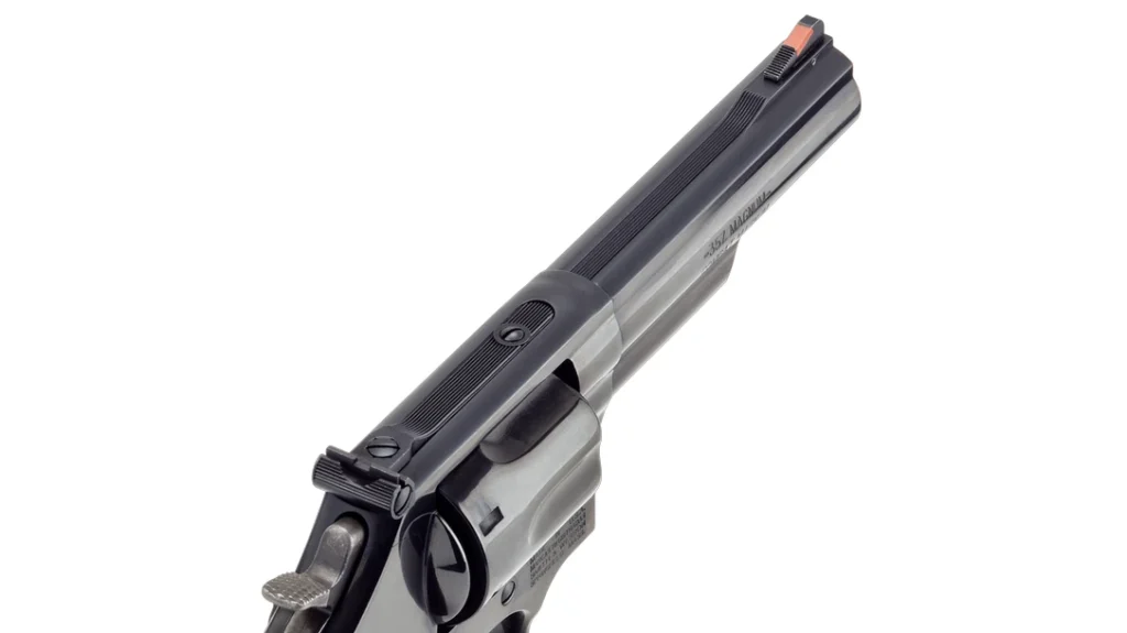 The front sight is a classic red ramp, and the rear sight is fully adjustable and blacked out.