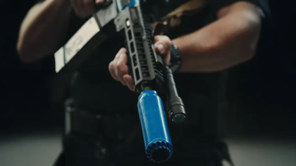 The HUXWRX 5.56 NLTA is marked blue as non-lethal.