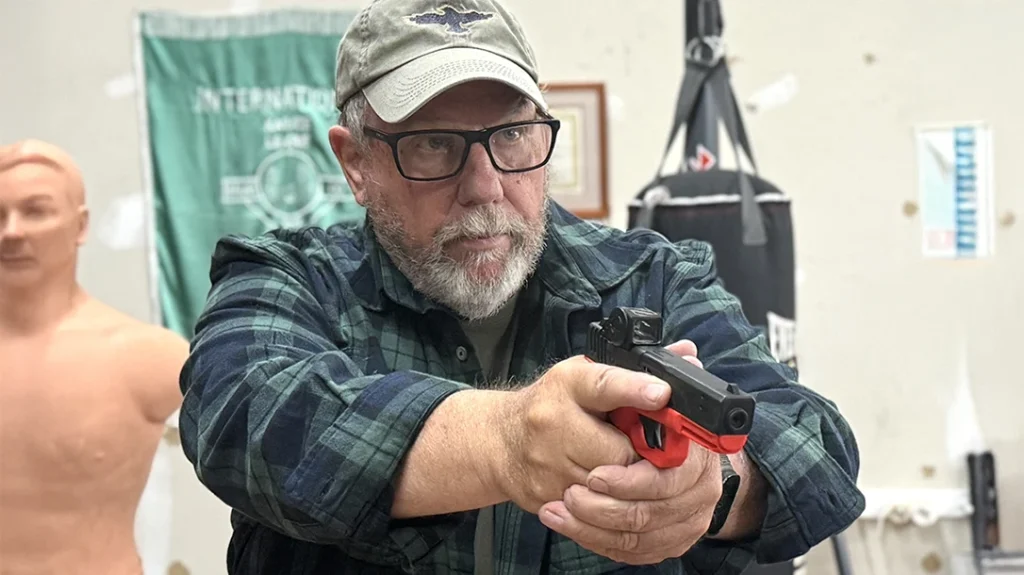 Most common low ready with the muzzle slightly depressed.