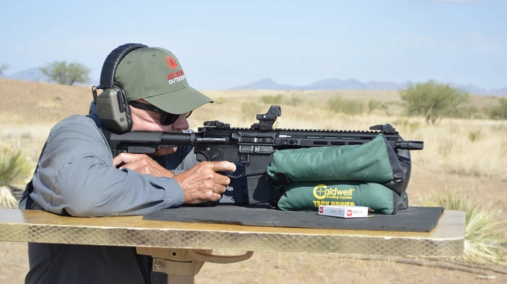 To test the Springfield Armory SAINT Victor 5.56 pistol for accuracy, the author set his targets out at 50 yards. He used a DOA Tactical shooting bench for support and fired all groups from a seated rest.