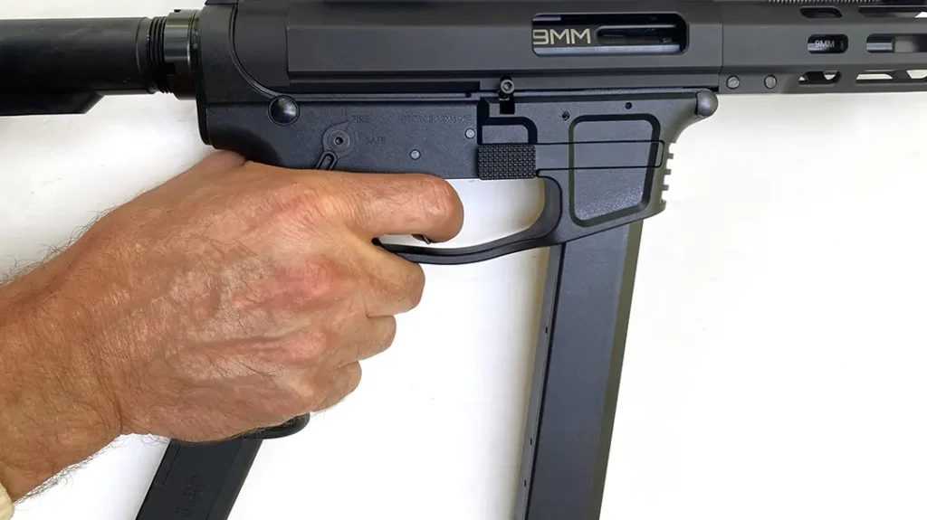 The pistol grip is aggressively stippled on the sides and is designed to hold an extra magazine at the ready.