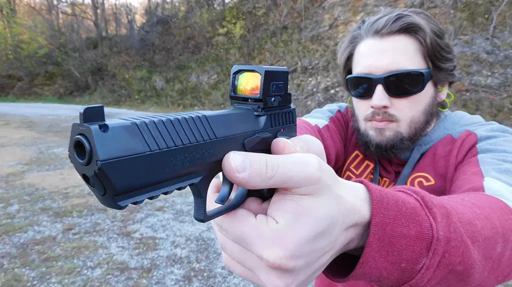 The author attached a closed-emitter Meprolight MPO Pro-F red dot because a gun built like a tank needs an optic with similar characteristics.