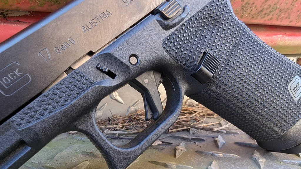 Glock added an undercut on the trigger guard to allow a high grip without getting Glock knuckle.