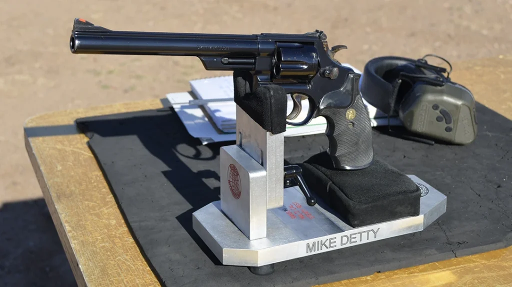 Or with the knuckle of the frame with trigger guard pressed against V block unit.