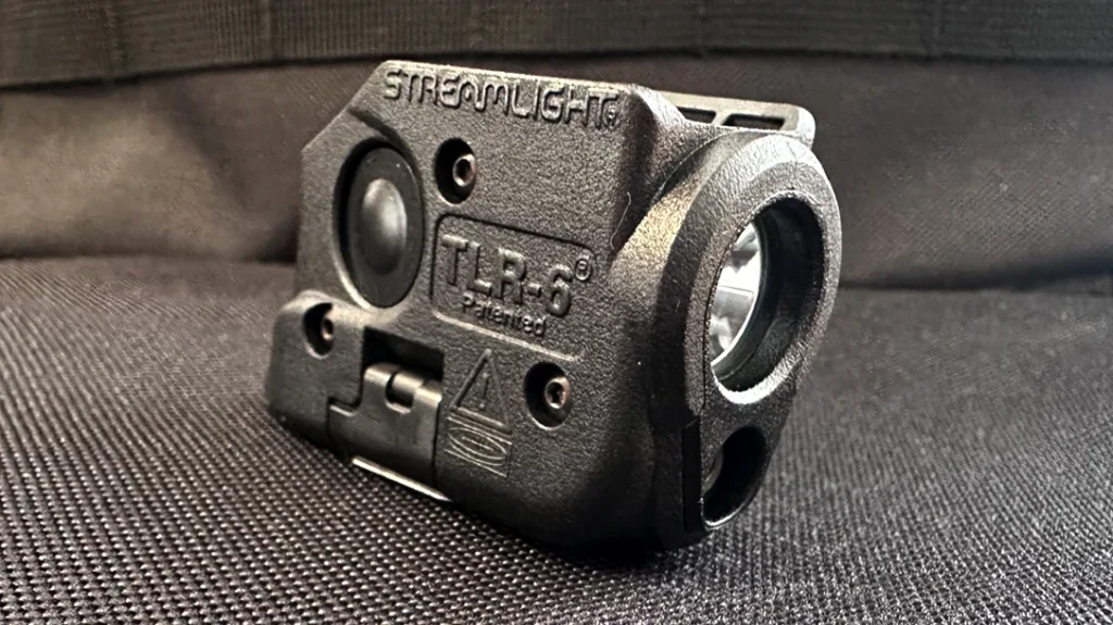 One of the author’s first light modifications for her handgun was the Streamlight TLR-6 Gun Light.