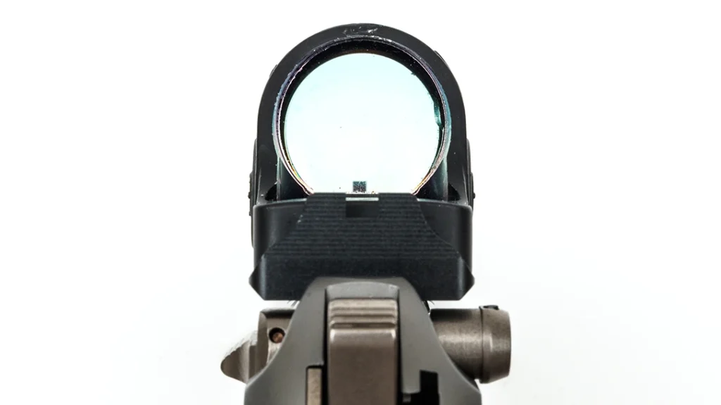 The pistol the author received for this review included the trigger job, an NP3 finish on several parts, an RMR plate, and a Trijicon SRO already installed.