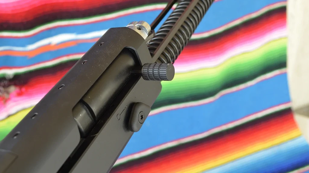 The charging handle can be removed and put on the other side.
