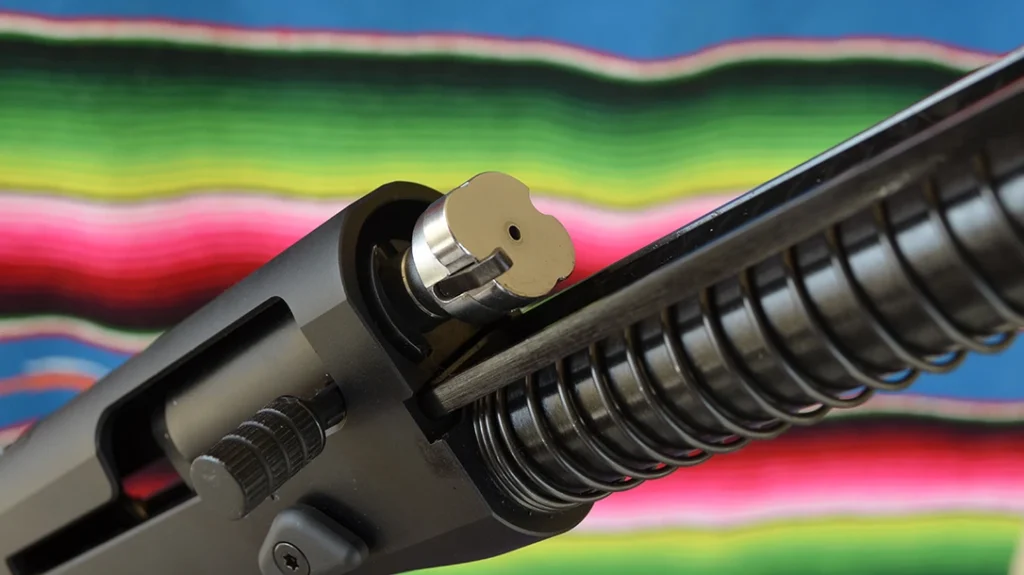 A rotating bolt head locks the bolt into the barrel at the moment the gun fires.