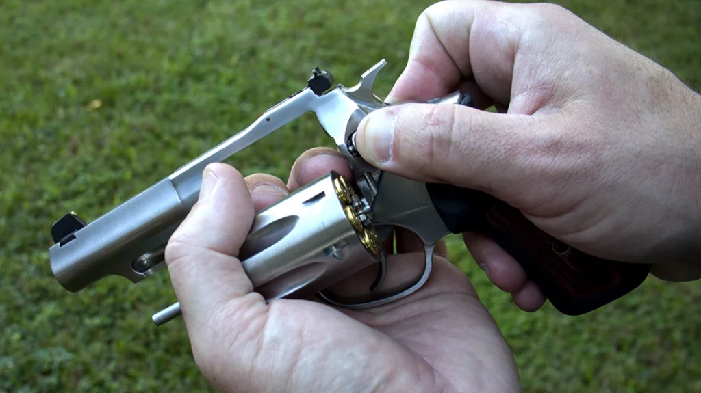 The cylinder button invites the user to push it, and the cylinder is easy to expose with the off hand.