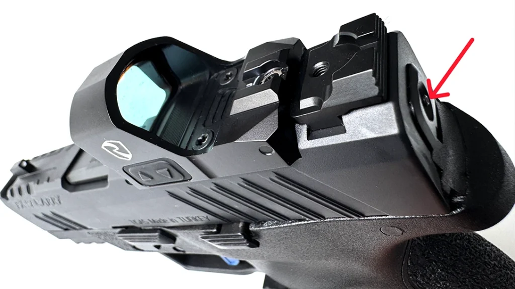 At the rear of the slide, in the center of the slide locking plate, the striker spring guide protrudes and acts as a loaded chamber indicator.