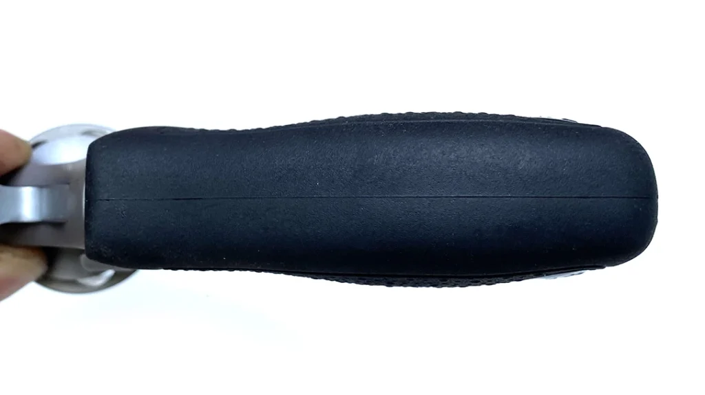 The once-piece grips on the Taurus Model 817 are sized for concealment but made for shootability with a soft rubber overmold, palm swells, finger grooves, and pebble-textured sides.