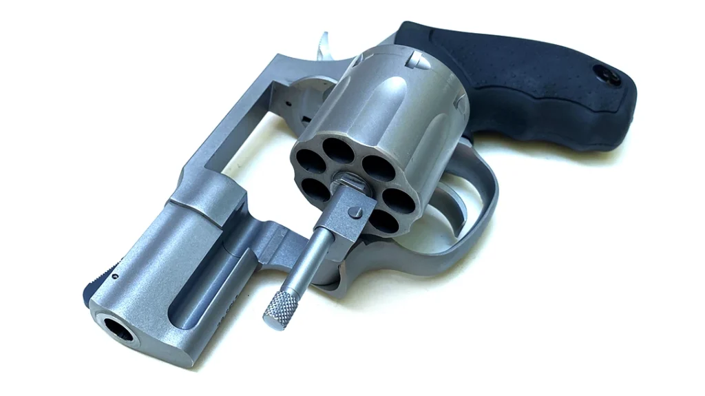 The Taurus Model 817 uses a spring-loaded pin in the crane that engages a slot in the frame in the manner of a ball-detent lock, but without much bite.