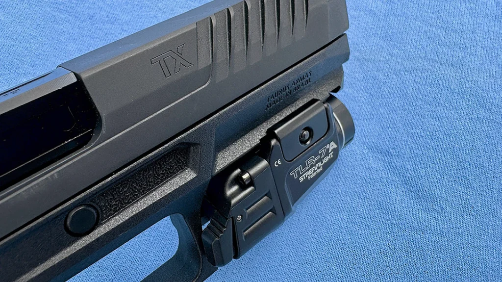 At one point, the author fitted the Taurus TX9 with a Streamlight TLR-7A tactical light in the last Picatinny rail notch nearest the trigger guard.