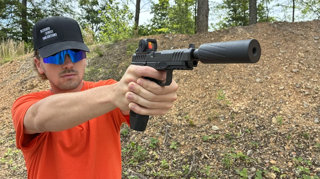 The Rost Martin RM1F equipped with EOTech's EFLX CE and Banish Suppressor being shot.