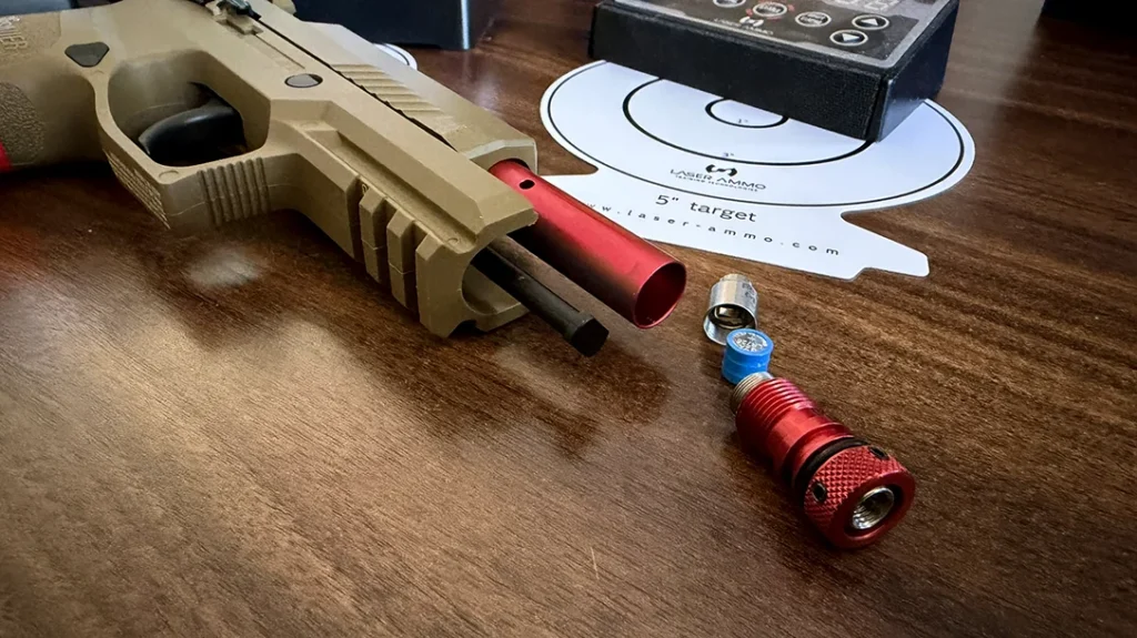 To prepare the Laser Ammo Recoil-Enabled Training Pistol for training, you have to install the battery into the laser.